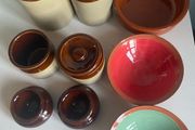 Selection of stoneware jars and condiment holders and Three little dishes added