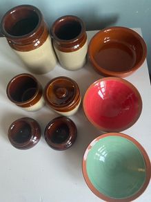 Selection of stoneware jars and condiment holders and Three little dishes added