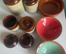 Selection of stoneware jars and condiment holders and Three little dishes added