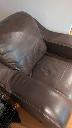 Dark brown leather armchair