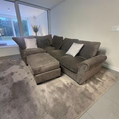 Grey corner sofa with matching footstool