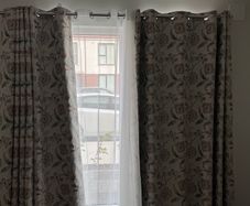 Full set of curtains, net curtains and curtain rods.
