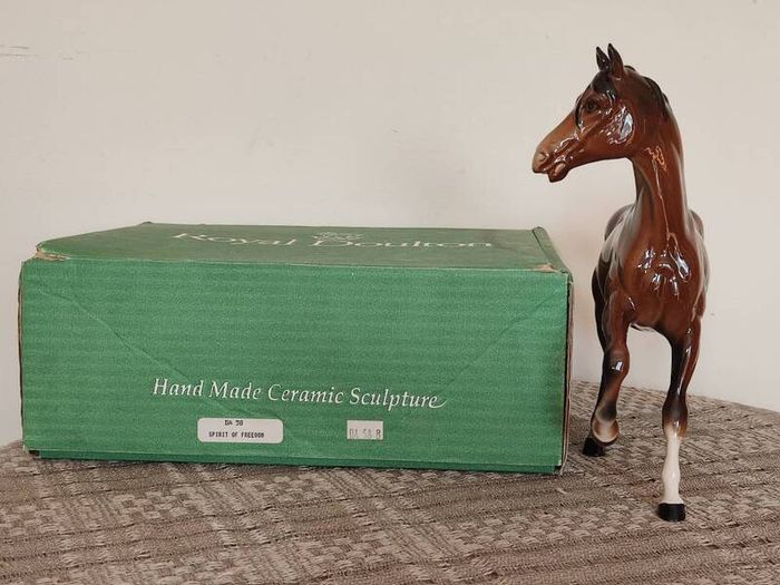 Vintage Royal Doultot porcelain horse. new in the box.