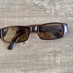 Vintage Ray-Ban sunglasses, Made in USA, with B&L engraved lenses and brown tortoiseshell frame. Lenses are in good condition, frame shows signs of wear. Please see all photos for details.