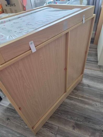 Kub Madera baby changing table and storage.