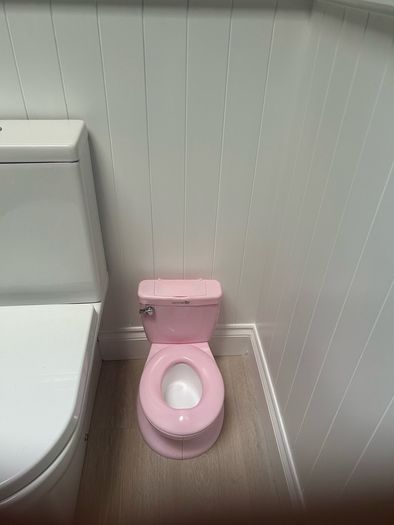 Pink potty with realistic flush