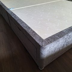 Grey fabric divan bed base with storage