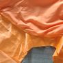 Solid orange satin look piece of fabric with beads Image 4