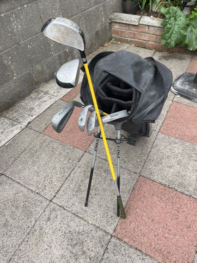 Left hand golf clubs and stand