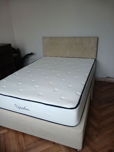 double bed with mattress and headboard