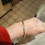 Silver tone bracelet with blue stones and words on it Image 6
