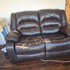 Brown 2 seater reclining couch.