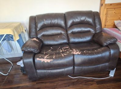 Brown 2 seater reclining couch.