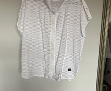 Naya white sleeveless blouse