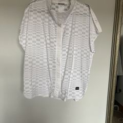 Naya white sleeveless blouse