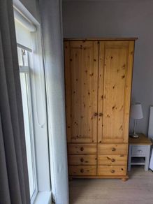 solid pine wardrobe with drawers.