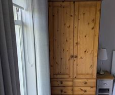 solid pine wardrobe with drawers.