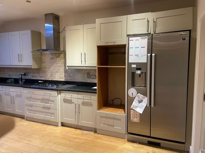Entire kitchen Quartz work top solid wooden shaker style doors