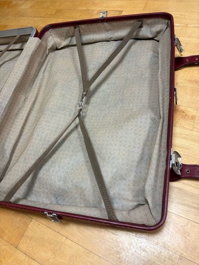 Vintage burgundy faux-leather suitcase