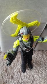 Limited edition This Action Man Air Patrol figure from Hasbro is a 12-inch electronic toy featuring a propeller backpack.The figure wears a distinctive neon yellow and gray flight suit and includes a helmet with a yellow visor.