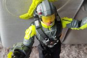 Limited edition This Action Man Air Patrol figure from Hasbro is a 12-inch electronic toy featuring a propeller backpack.The figure wears a distinctive neon yellow and gray flight suit and includes a helmet with a yellow visor.