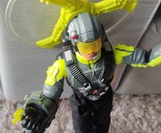 Limited edition This Action Man Air Patrol figure from Hasbro is a 12-inch electronic toy featuring a propeller backpack.The figure wears a distinctive neon yellow and gray flight suit and includes a helmet with a yellow visor.