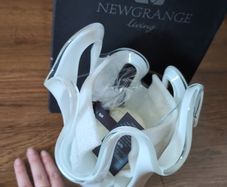Newbridge home sculpted candle holder and candle.  Brand new in box.