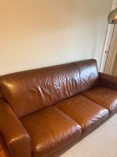 brown leather couch and chair