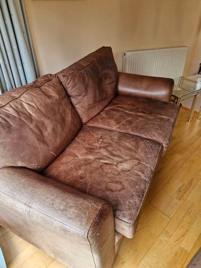 brown leather sofa and arm chair