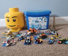12 LEGO Sets + Large tub assorted Lego + Lego Head Storage Bin