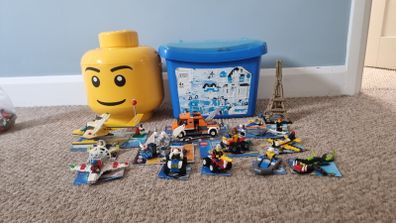 12 LEGO Sets + Large tub assorted Lego + Lego Head Storage Bin