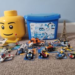 12 LEGO Sets + Large tub assorted Lego + Lego Head Storage Bin