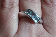 925 sterling silver trilogy ring with blue topaz.