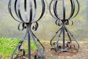 Vintage pair of wrought iron garden basket planters