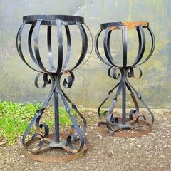 Vintage pair of wrought iron garden basket planters