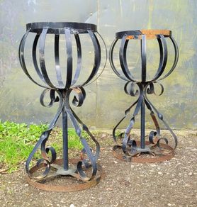 Vintage pair of wrought iron garden basket planters