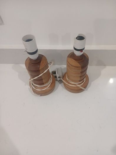 pair of handcarved wooden lamps