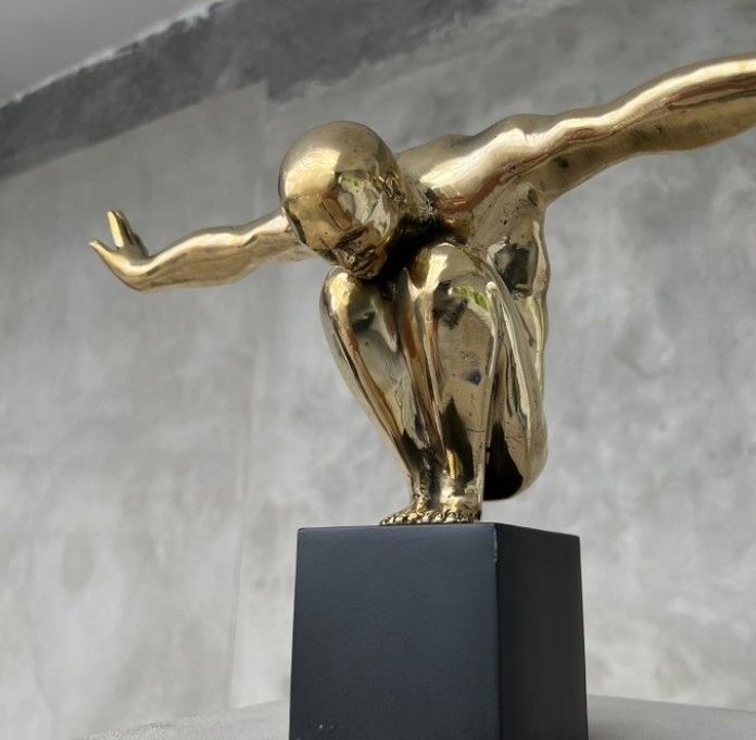 Large bronze statue on custom stand