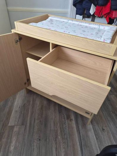 Kub Madera baby changing table and storage.