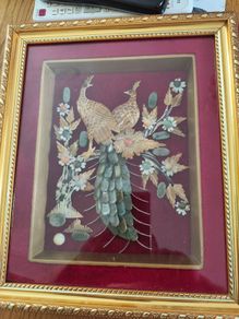 Peacock couple FRAMED IN GELDED FRAM Jade with Seashells painting is created by Myanmar artists