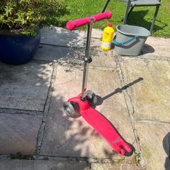 Young child's light up wheel scooter.