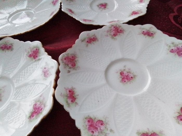 Six Pretty China Saucers