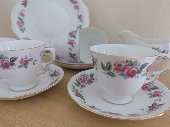 Queen Anne Bone China, tea set for 4 person, contains 11 pcs, including 4 tea cups, 4 saucers, a milk jar, a sugar bowl and a cookie serving plate 22cm. Impeccable conditions, looks like a new one, any scratches, cracks or cips.