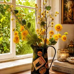 Vintage metal flower pitcher with a high-quality artificial floral arrangement