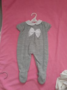 grey knitted baby onesey