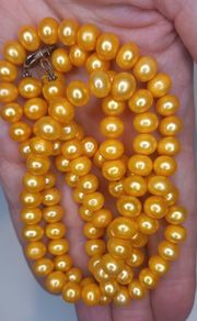 Vintage yellow beads made of natural freshwater pearls.
