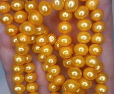 Vintage yellow beads made of natural freshwater pearls.