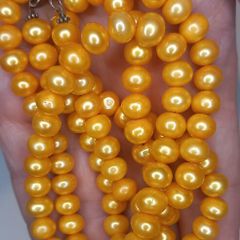 Vintage yellow beads made of natural freshwater pearls.
