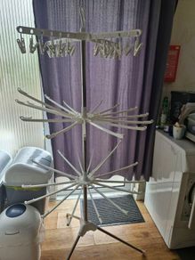 Rotating folding clothes drying rack