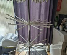 Rotating folding clothes drying rack
